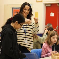 Staff and students working together to make drums